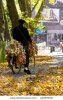 stock-photo-french-man-riding-down-leafy-garden-path-on-bicycle-loaded-with-onions-and-garlic-22.jpg